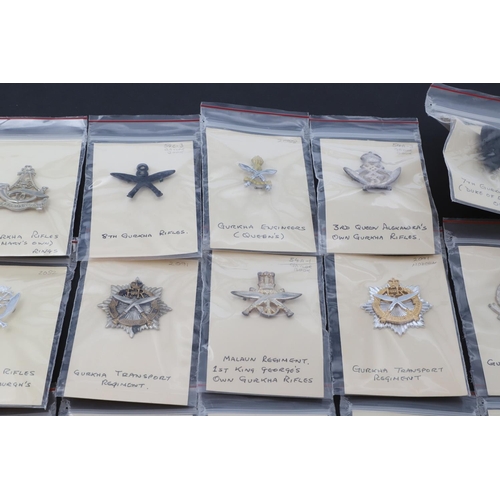 358 - A COLLECTION OF CAP BADGES FOR GURKHA REGIMENTS. A collection of cap and similar badges for the Gurk... 