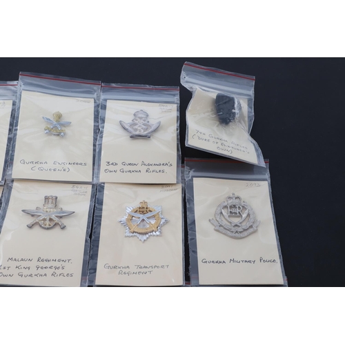 358 - A COLLECTION OF CAP BADGES FOR GURKHA REGIMENTS. A collection of cap and similar badges for the Gurk... 