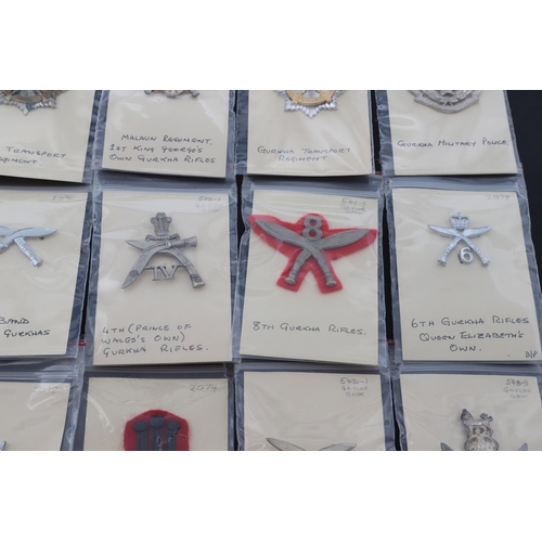 358 - A COLLECTION OF CAP BADGES FOR GURKHA REGIMENTS. A collection of cap and similar badges for the Gurk... 