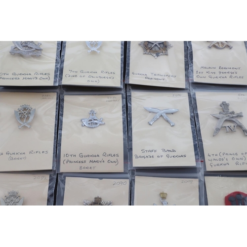 358 - A COLLECTION OF CAP BADGES FOR GURKHA REGIMENTS. A collection of cap and similar badges for the Gurk... 