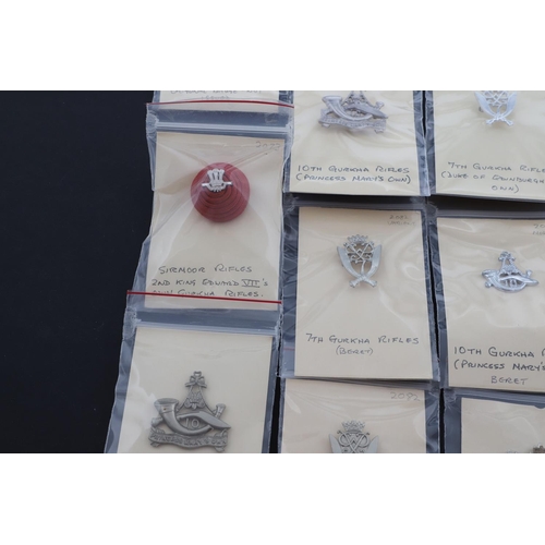 358 - A COLLECTION OF CAP BADGES FOR GURKHA REGIMENTS. A collection of cap and similar badges for the Gurk... 