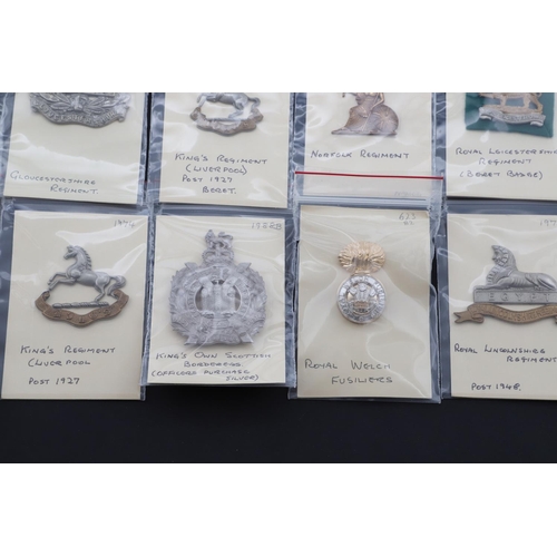 365 - A COLLECTION OF BRITISH ARMY CAP BADGES FOR INFANTRY OF THE LINE POST WORLD WAR ONE. A collection of... 