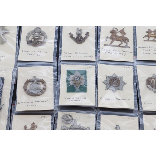 365 - A COLLECTION OF BRITISH ARMY CAP BADGES FOR INFANTRY OF THE LINE POST WORLD WAR ONE. A collection of... 