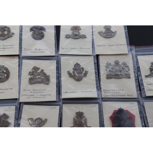 380 - A COLLECTION OF BRITISH MILITARY BADGES AS WORN ON SLOUCH HATS AND FORAGE CAPS BY INFANTRY REGIMENTS... 