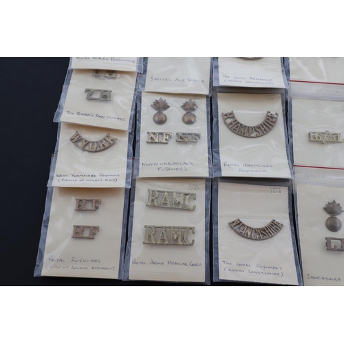 394 - A COLLECTION OF BRITISH MILITARY BRASS SHOULDER TITLES. An extensive collection of Shoulder Titles t... 