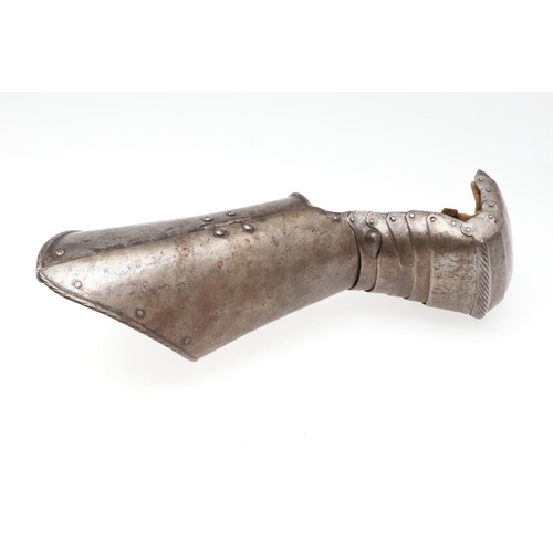 396 - A MID 16TH CENTURY MITTEN GAUNTLET. A steel mitten gauntlet for the left hand, with a flared tubular... 