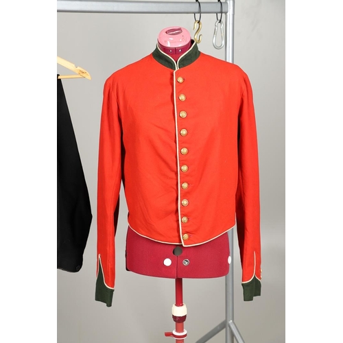 400 - A VICTORIAN 11th REGIMENT OF FOOT (NORTH DEVON) UNIFORM. A red tunic with dark green collar and cuff... 