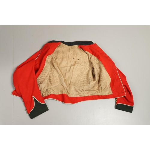 400 - A VICTORIAN 11th REGIMENT OF FOOT (NORTH DEVON) UNIFORM. A red tunic with dark green collar and cuff... 