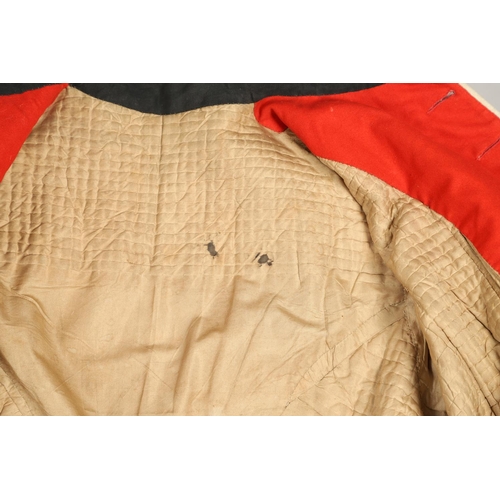 400 - A VICTORIAN 11th REGIMENT OF FOOT (NORTH DEVON) UNIFORM. A red tunic with dark green collar and cuff... 