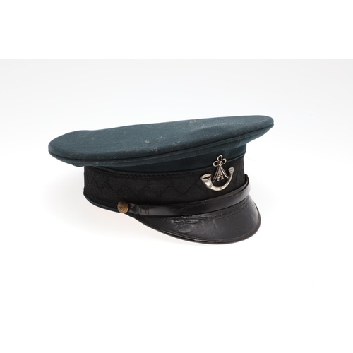 403 - A 1908 PATTERN PEAKED CAP WITH OXFORD AND BUCKS LIGHT INFANTRY BADGE. A black 1908 pattern peaked ca... 