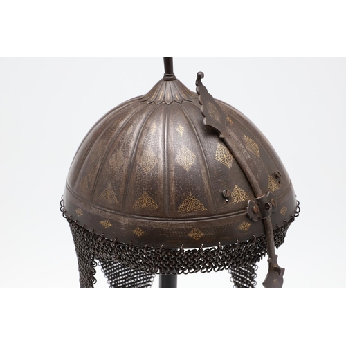 404 - A 19TH CENTURY INDO PERSIAN KULAH KHUD HELMET. With a decorative fluted bowl with central plume fixi... 