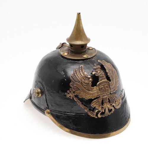 407 - A FIRST WORLD WAR PRUSSIAN INFANTRY TYPE PICKELHAUBE. a black leather pickelhaube type helmet, the h... 