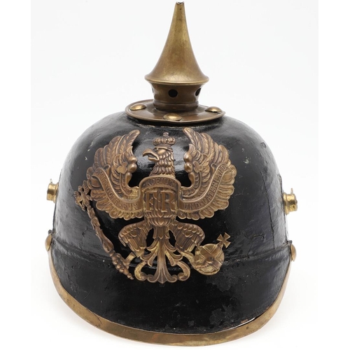 407 - A FIRST WORLD WAR PRUSSIAN INFANTRY TYPE PICKELHAUBE. a black leather pickelhaube type helmet, the h... 