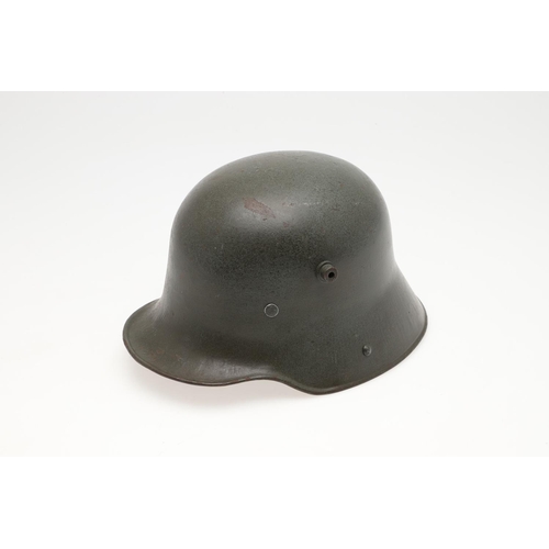 408 - A FIRST WORLD WAR M.17 STEEL HELMET. A Great War Trench Helmet with fieldgrey finish, stamped ET64 i... 