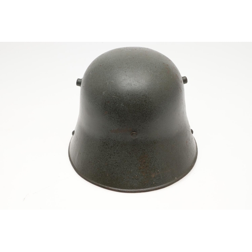 408 - A FIRST WORLD WAR M.17 STEEL HELMET. A Great War Trench Helmet with fieldgrey finish, stamped ET64 i... 