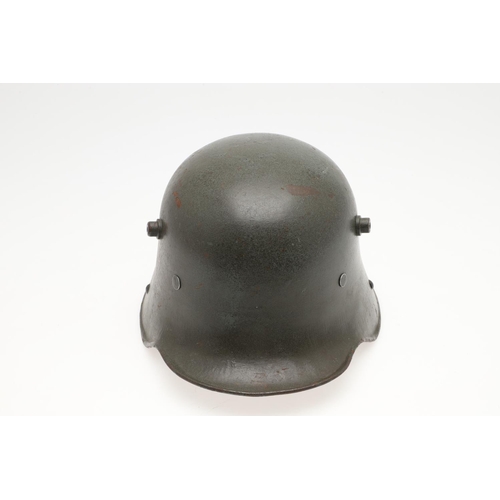 408 - A FIRST WORLD WAR M.17 STEEL HELMET. A Great War Trench Helmet with fieldgrey finish, stamped ET64 i... 