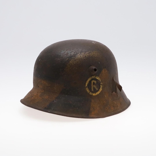 409 - A GERMAN MANUFACTURED TURKISH M1918 STEEL HELMET. The helmet with twin lugs and folded rim, the fron... 