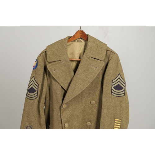 425 - A SECOND WORLD WAR OR LATER AMERICAN UNIFORM GREAT COAT. An American soldier's  uniform great coat w... 