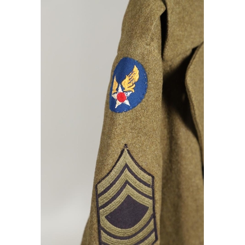 425 - A SECOND WORLD WAR OR LATER AMERICAN UNIFORM GREAT COAT. An American soldier's  uniform great coat w... 