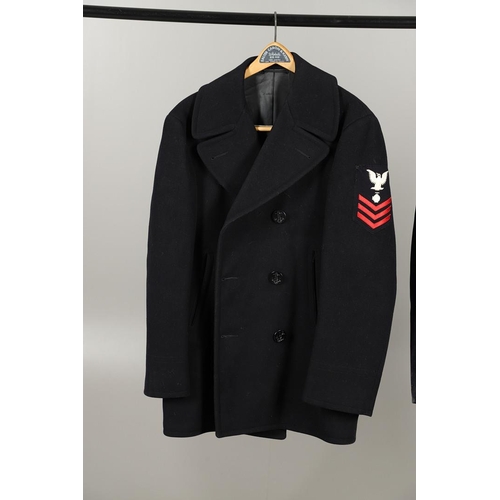 429 - TWO POST SECOND WORLD WAR US NAVY PEA COATS AND A SIMILAR ARMY COAT. A dark blue navy double breaste... 