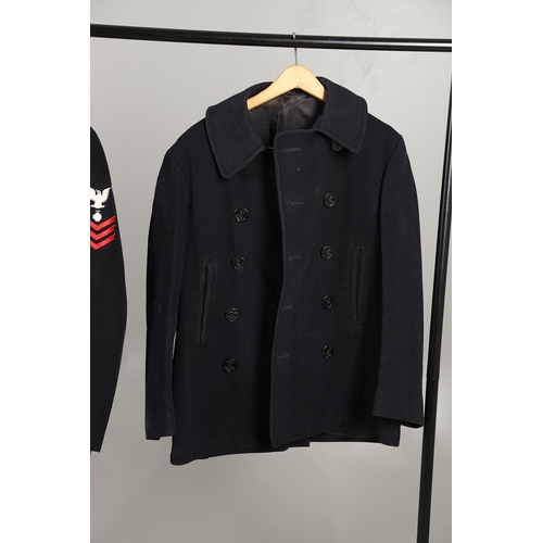 429 - TWO POST SECOND WORLD WAR US NAVY PEA COATS AND A SIMILAR ARMY COAT. A dark blue navy double breaste... 