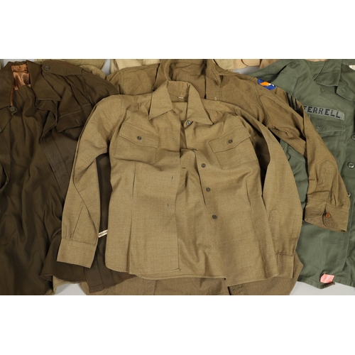 430 - A COLLECTION OF FOURTEEN MILITARY SHIRTS OR LIGHT JACKETS, MANY WITH AMERICAN INSIGNIA. A varied col... 