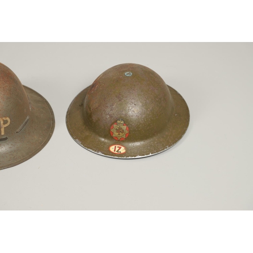 434 - A SECOND WORLD WAR FIRE SERVICE HELMET AND TWO OTHERS. A Second World War fire service helmet with N... 