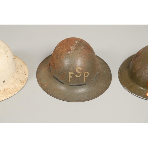 434 - A SECOND WORLD WAR FIRE SERVICE HELMET AND TWO OTHERS. A Second World War fire service helmet with N... 