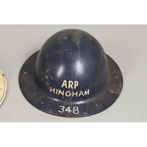 439 - A SECOND WORLD WAR WARDEN's  HELMET AND TWO OTHERS. A Second World War helmet with a white 'W' to th... 