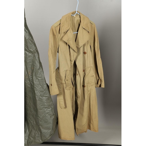 443 - AN AMERICAN VIETNAM PERIOD PONCHO AND FOUR UNIFORM OVERCOATS. A Vietnam era poncho by the Southern A... 