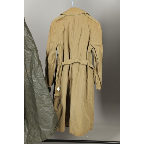 443 - AN AMERICAN VIETNAM PERIOD PONCHO AND FOUR UNIFORM OVERCOATS. A Vietnam era poncho by the Southern A... 