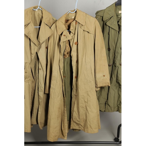 443 - AN AMERICAN VIETNAM PERIOD PONCHO AND FOUR UNIFORM OVERCOATS. A Vietnam era poncho by the Southern A... 