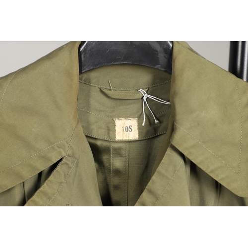 443 - AN AMERICAN VIETNAM PERIOD PONCHO AND FOUR UNIFORM OVERCOATS. A Vietnam era poncho by the Southern A... 