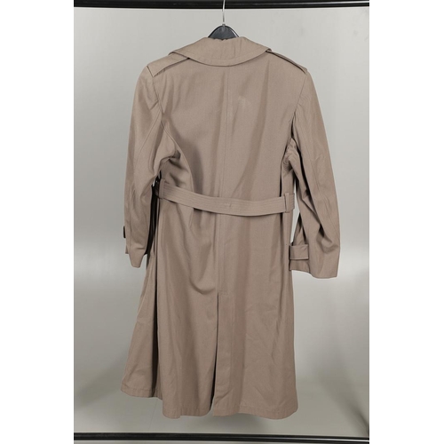 443 - AN AMERICAN VIETNAM PERIOD PONCHO AND FOUR UNIFORM OVERCOATS. A Vietnam era poncho by the Southern A... 