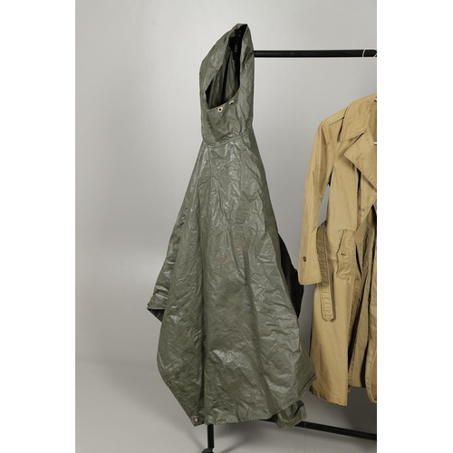 443 - AN AMERICAN VIETNAM PERIOD PONCHO AND FOUR UNIFORM OVERCOATS. A Vietnam era poncho by the Southern A... 