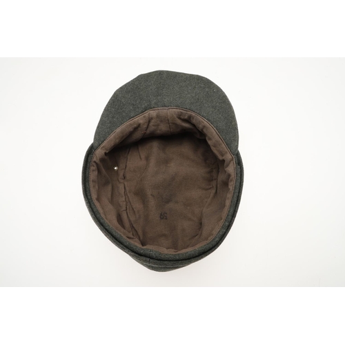 452 - A SECOND WORLD WAR GERMAN WAFFEN-SS M43 TYPE CAP. A fieldgrey cap, the fabric badge with an eagle ov... 