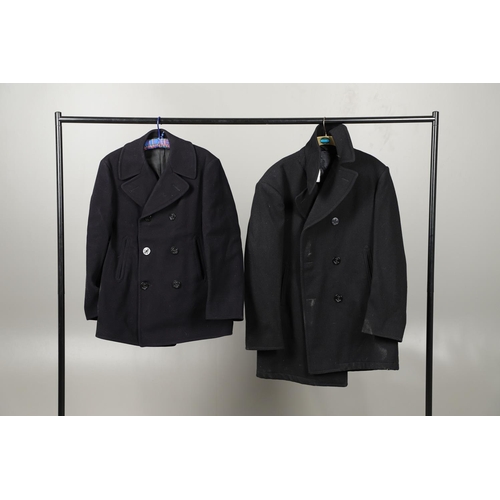 456 - TWO POST SECOND WORLD WAR U.S. NAVY 'PEA' COATS. A dark blue/black navy double breasted 'pea' coat w... 