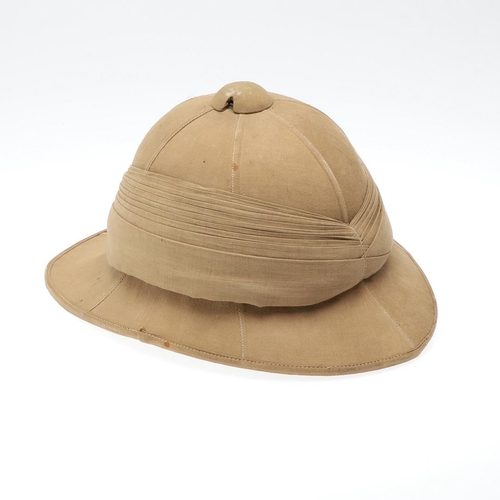 458 - A SECOND WORLD WAR OR LATER GOVERNMENT ISSUE PITH HELMET. A pith helmet stamped with a government is... 