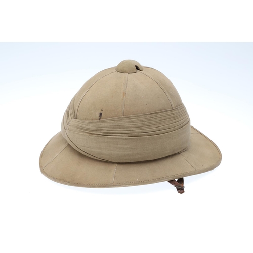 458 - A SECOND WORLD WAR OR LATER GOVERNMENT ISSUE PITH HELMET. A pith helmet stamped with a government is... 