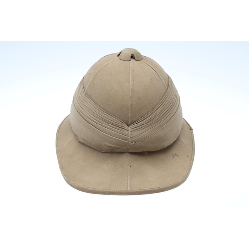 458 - A SECOND WORLD WAR OR LATER GOVERNMENT ISSUE PITH HELMET. A pith helmet stamped with a government is... 