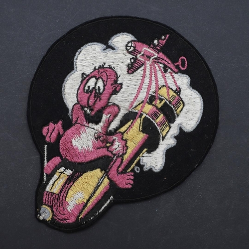 459 - A RARE SECOND WORLD WAR AMERICAN 702ND BOMBARDMENT SQUADRON JACKET PATCH. With an imp riding on a fa... 