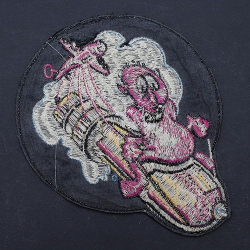 459 - A RARE SECOND WORLD WAR AMERICAN 702ND BOMBARDMENT SQUADRON JACKET PATCH. With an imp riding on a fa... 