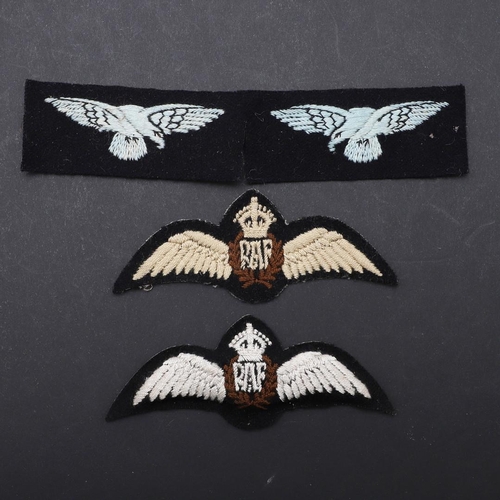 474 - TWO RAF CAP BADGES, PADDED AND FLAT AND TWO UN-ISSUED SHOULDER PATCHES. Two R.A.F. cap badges, one o... 