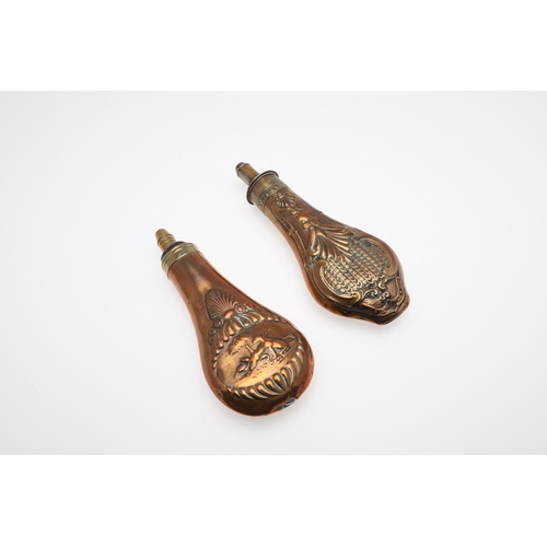 486 - TWO LATE 19TH CENTURY COPPER AND BRASS POWDER FLASKS. A Copper bodied powder flask decorated with a ... 