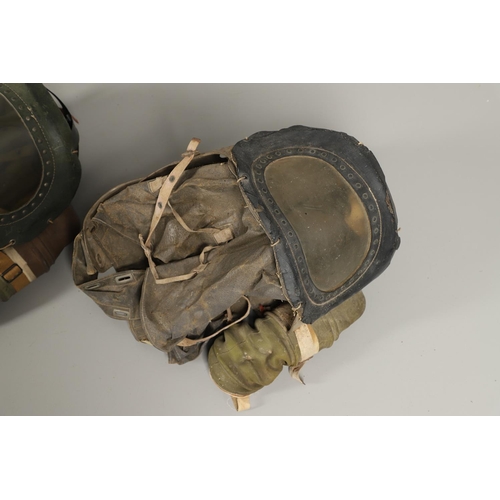 497 - A SECOND WORLD WAR BABY's  GAS MASK. A rare British Baby Gas mask or C3 Babies protective helmet, st... 