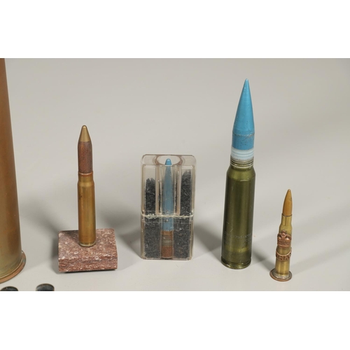 505 - A COLLECTION OF SHELL CASES, DUMMY ROUNDS AND A REPRODUCTION GRENADE. A 1947 3-IN-50 CAL Mk 7 shell ... 