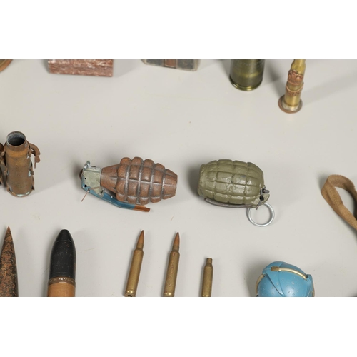 505 - A COLLECTION OF SHELL CASES, DUMMY ROUNDS AND A REPRODUCTION GRENADE. A 1947 3-IN-50 CAL Mk 7 shell ... 