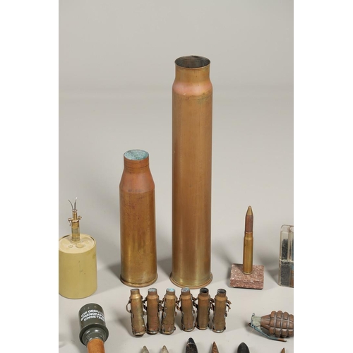 505 - A COLLECTION OF SHELL CASES, DUMMY ROUNDS AND A REPRODUCTION GRENADE. A 1947 3-IN-50 CAL Mk 7 shell ... 