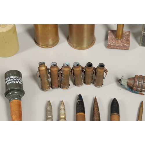 505 - A COLLECTION OF SHELL CASES, DUMMY ROUNDS AND A REPRODUCTION GRENADE. A 1947 3-IN-50 CAL Mk 7 shell ... 