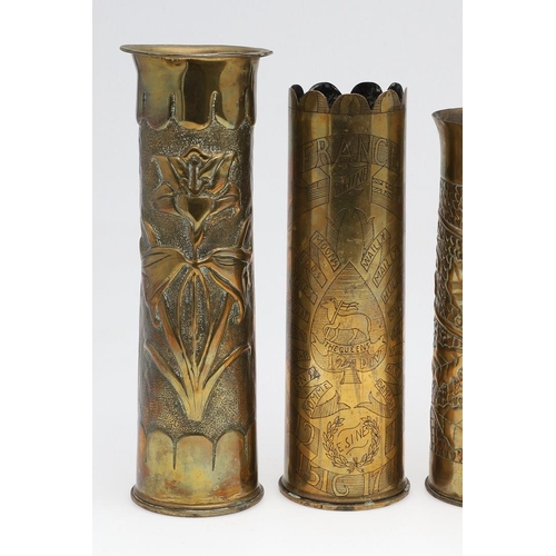 511 - AN INTERESTING COLLECTION OF SEVEN FIRST WORLD WAR TRENCH ART SHELL CASES. A pair of Trench art vase... 